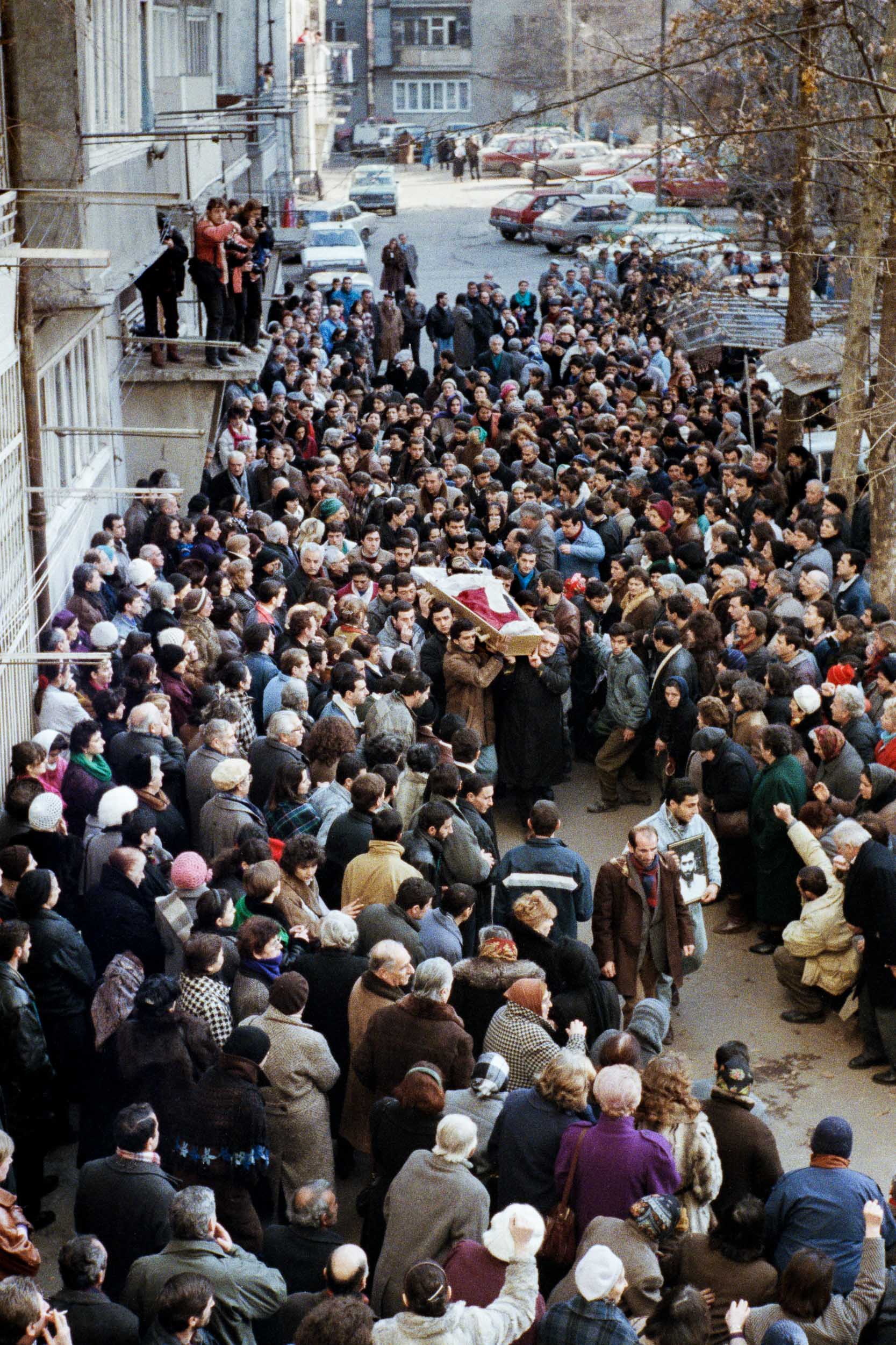 Pall bearers carry the body of  Levan Tactakichvili out of his apartment building. He was  killed by opposition fighters during a protest demonstration.