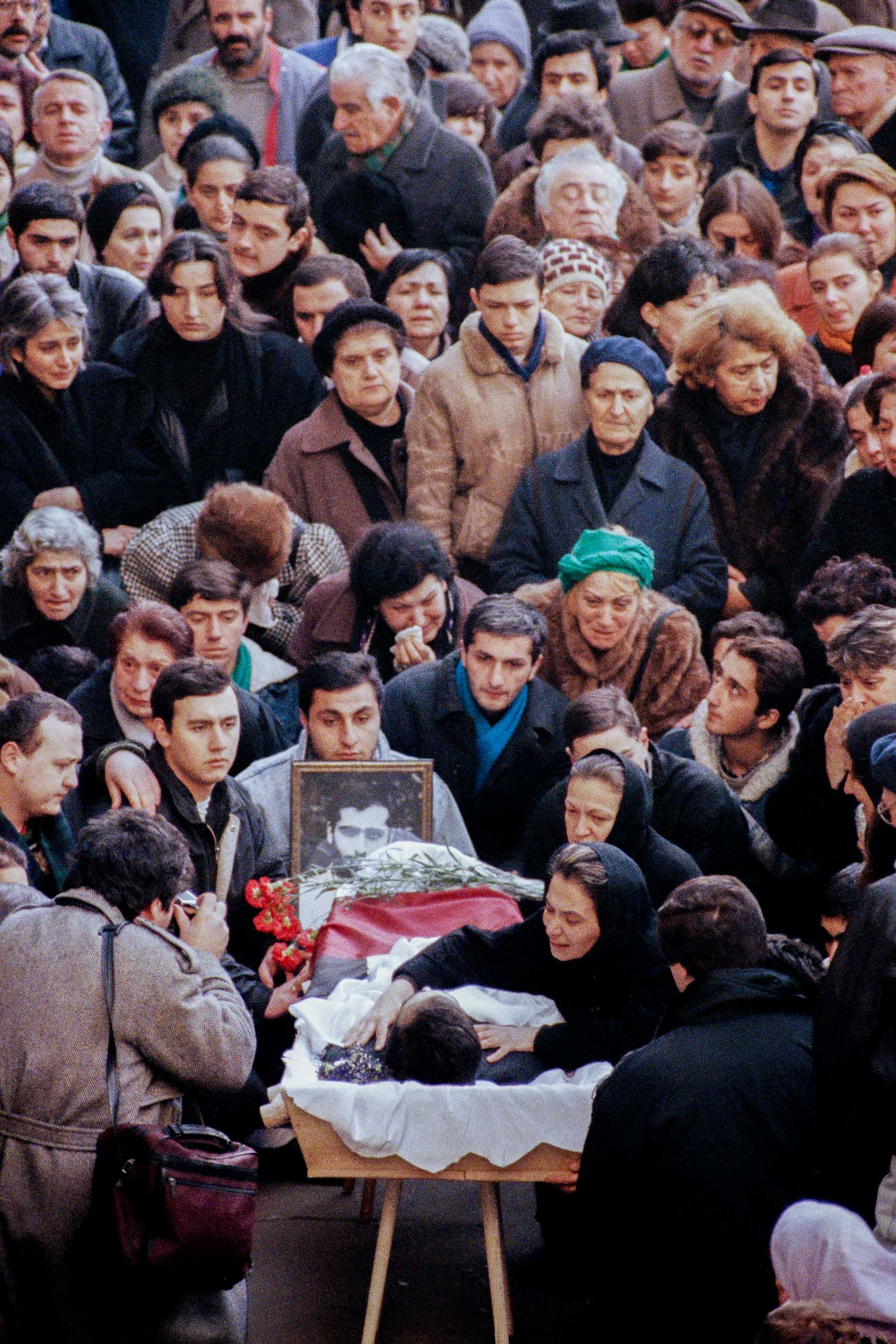 The mother of  Levan Tactakichvili leans over his body. He was  killed by opposition fighters during a protest demonstration. Tbilisi, Georgia
