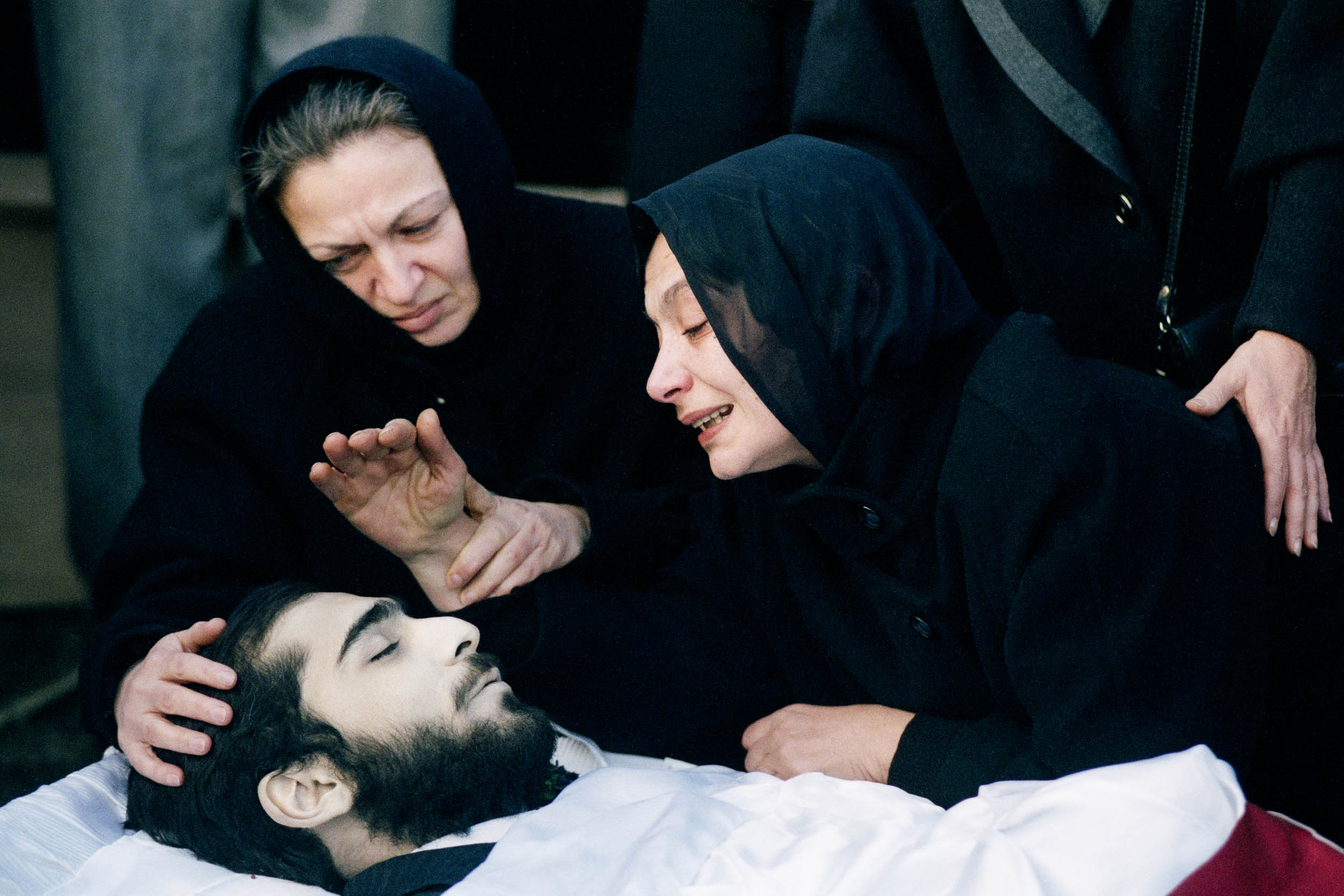 The mother of  Levan Tactakichvili says her last farewells at the graveside. Tbilisi, Georgia