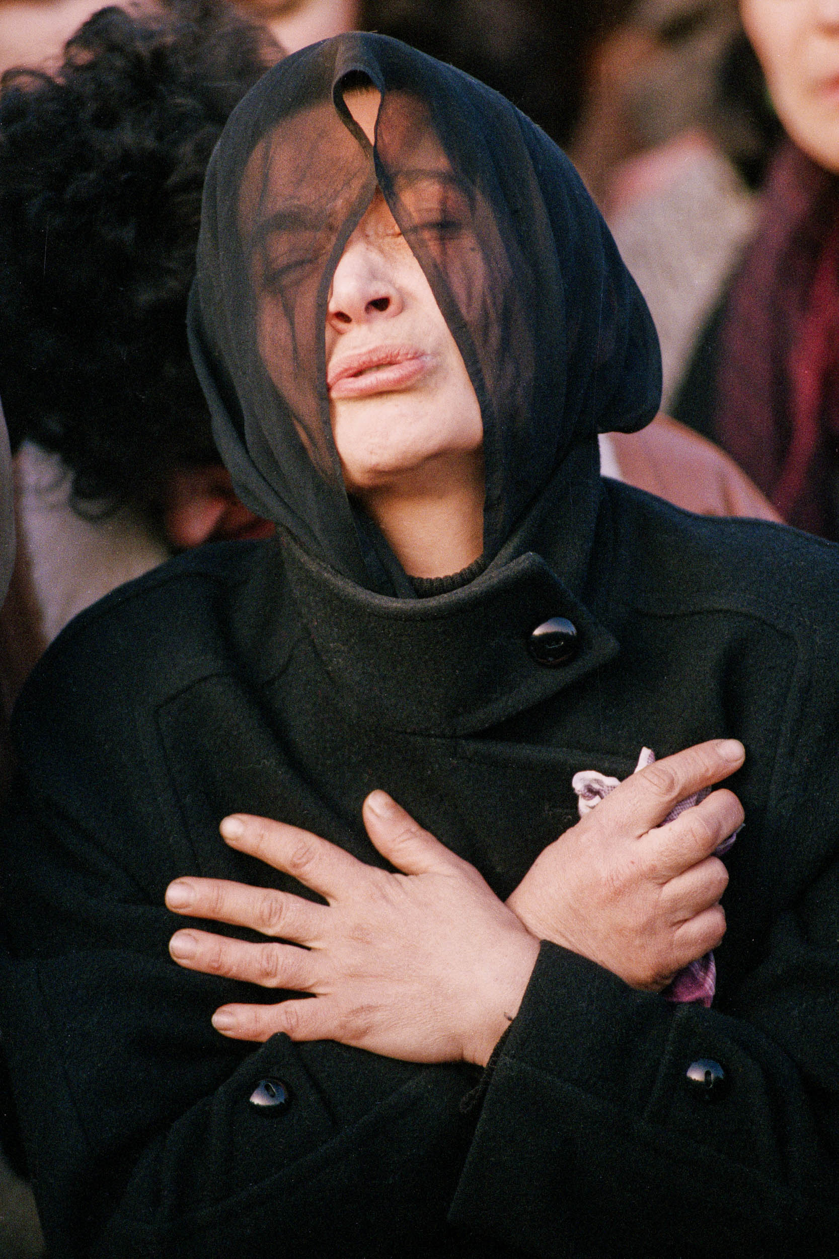 The mother of  Levan Tactakichvili grieves  him at the graveside. Tbilisi, Georgia