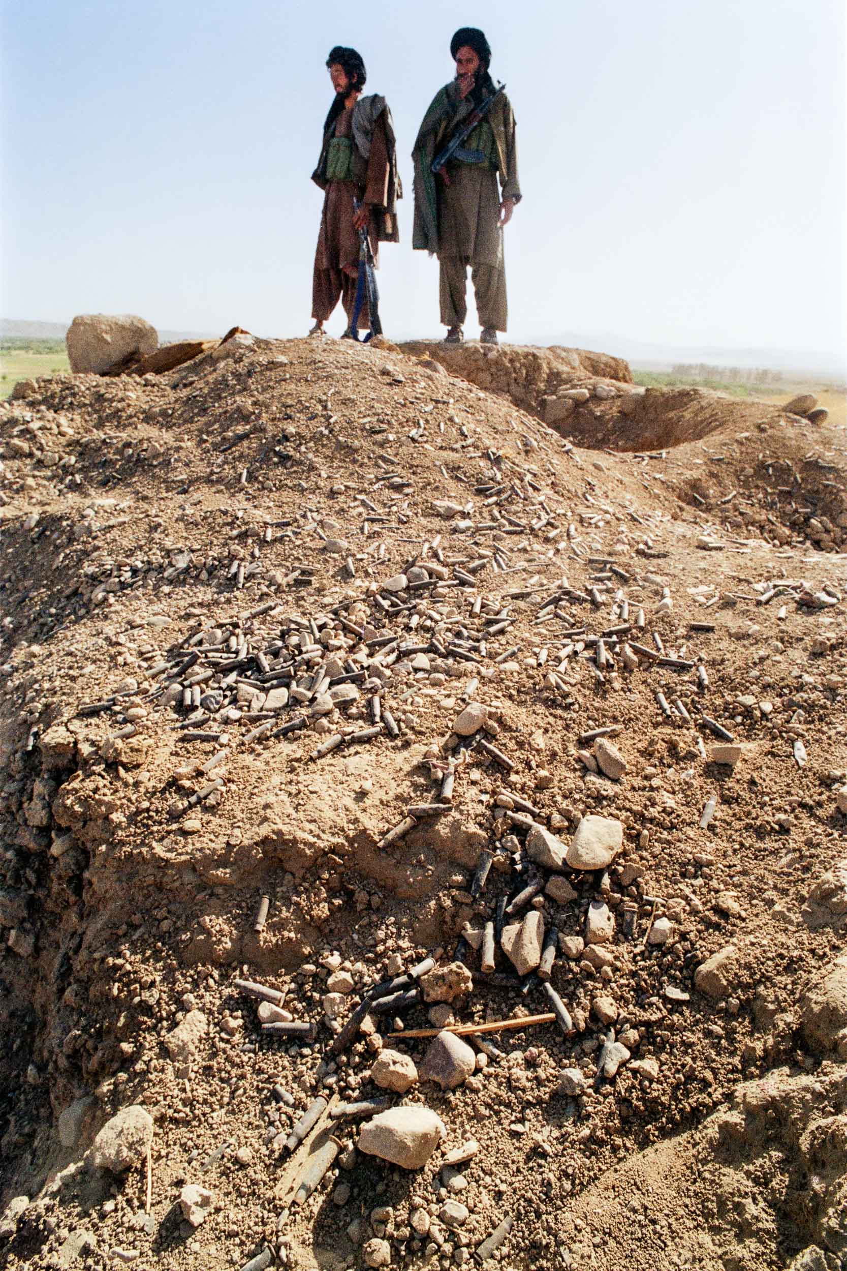  Mujahideen inspect ruins after a battle, Afghanistan 1988 