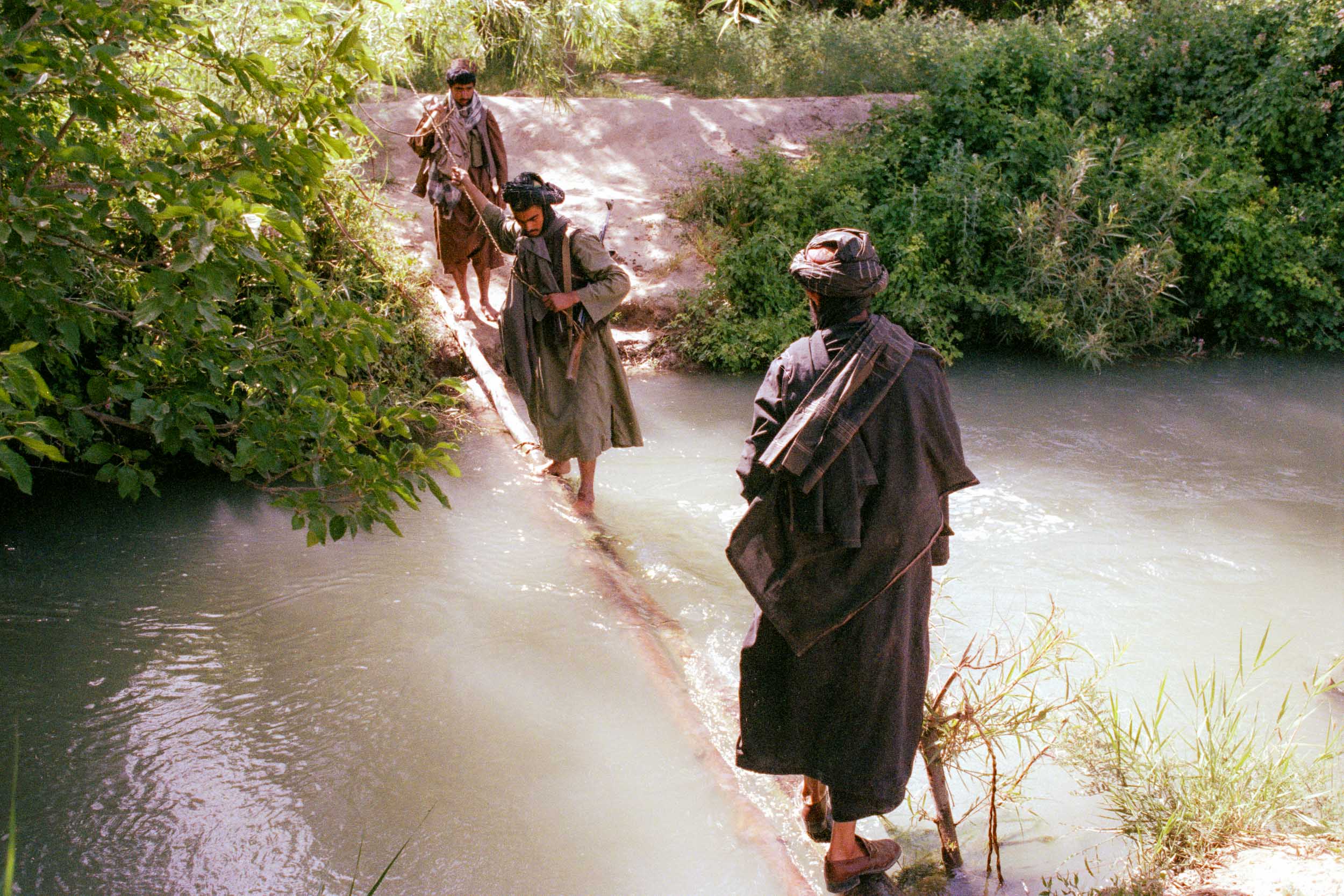 Mujahideen march through suburbs of Kandahar, Afghanistan 1988