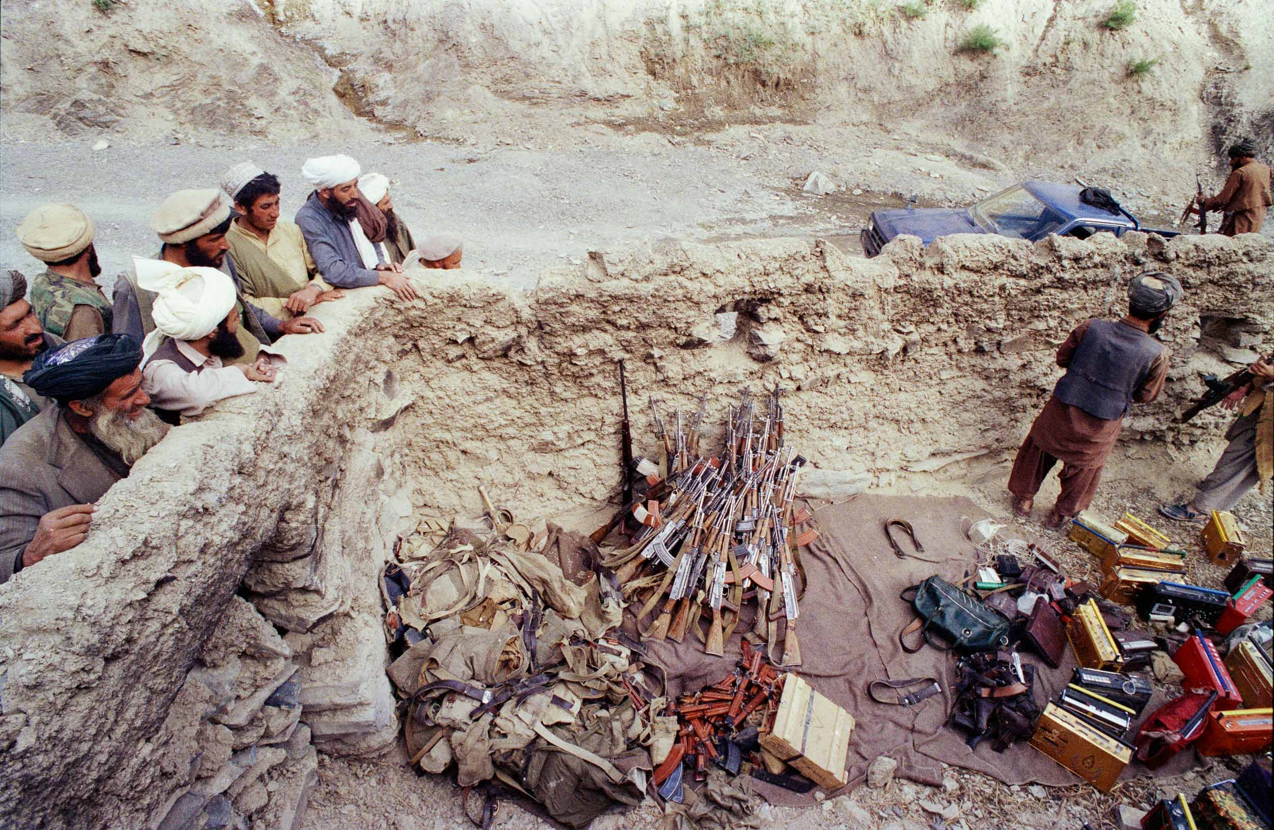 Mujahideen watch surrendered military equipment,  Afghanistan 1988