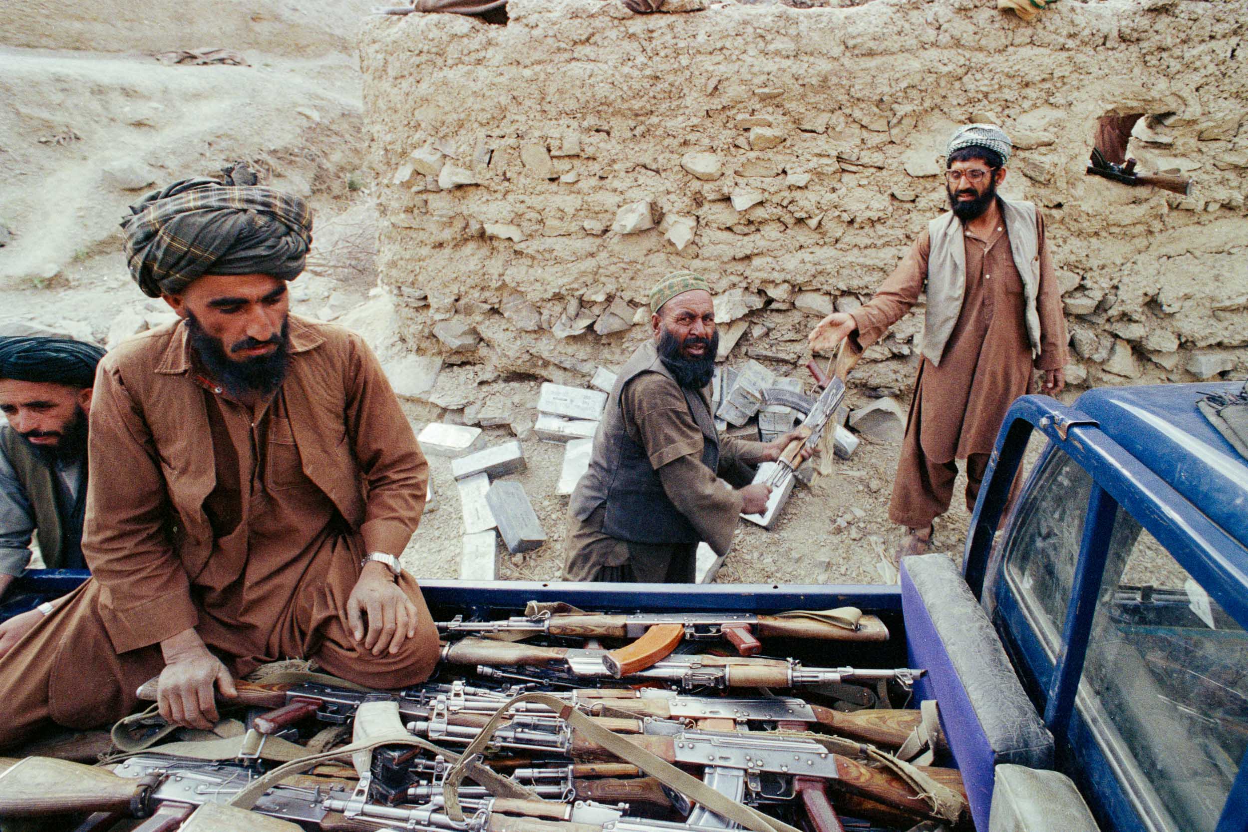  Mujahideen load surrendered military equipment on a truck,  Afghanistan 1988