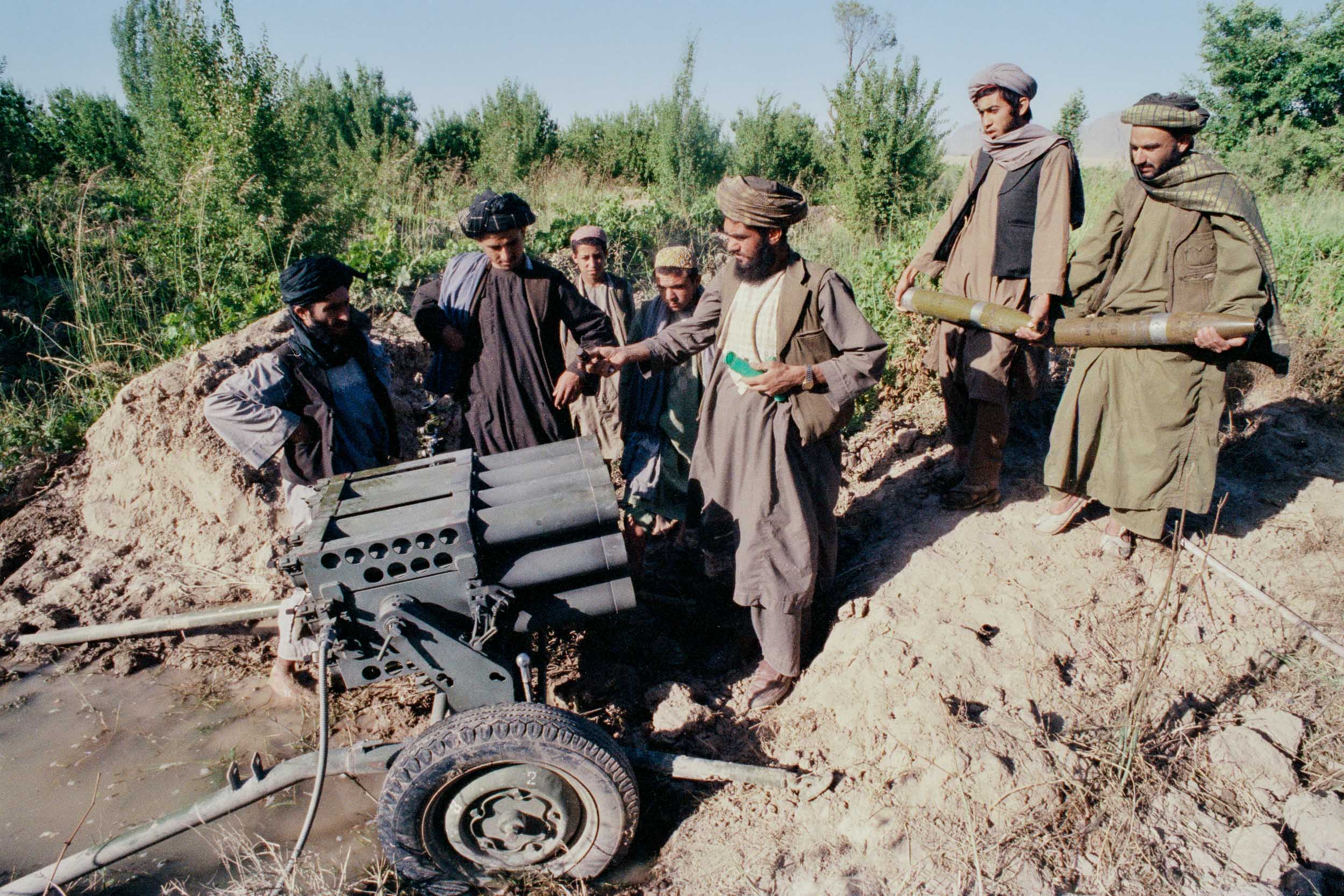  Mujahideen load a Chinese made, Type 63 12-tube, 107mm rocket launcher,  Afghanistan 1988