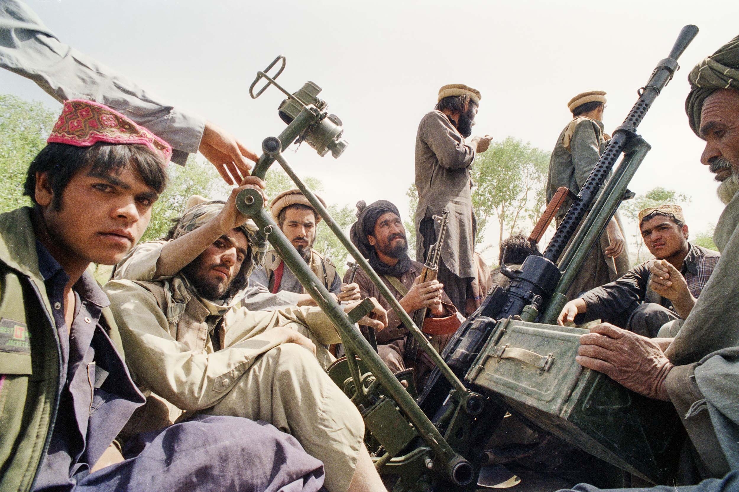 Mujahideen in a truck with an old anti-aircraft gun., Afghanistan 1988