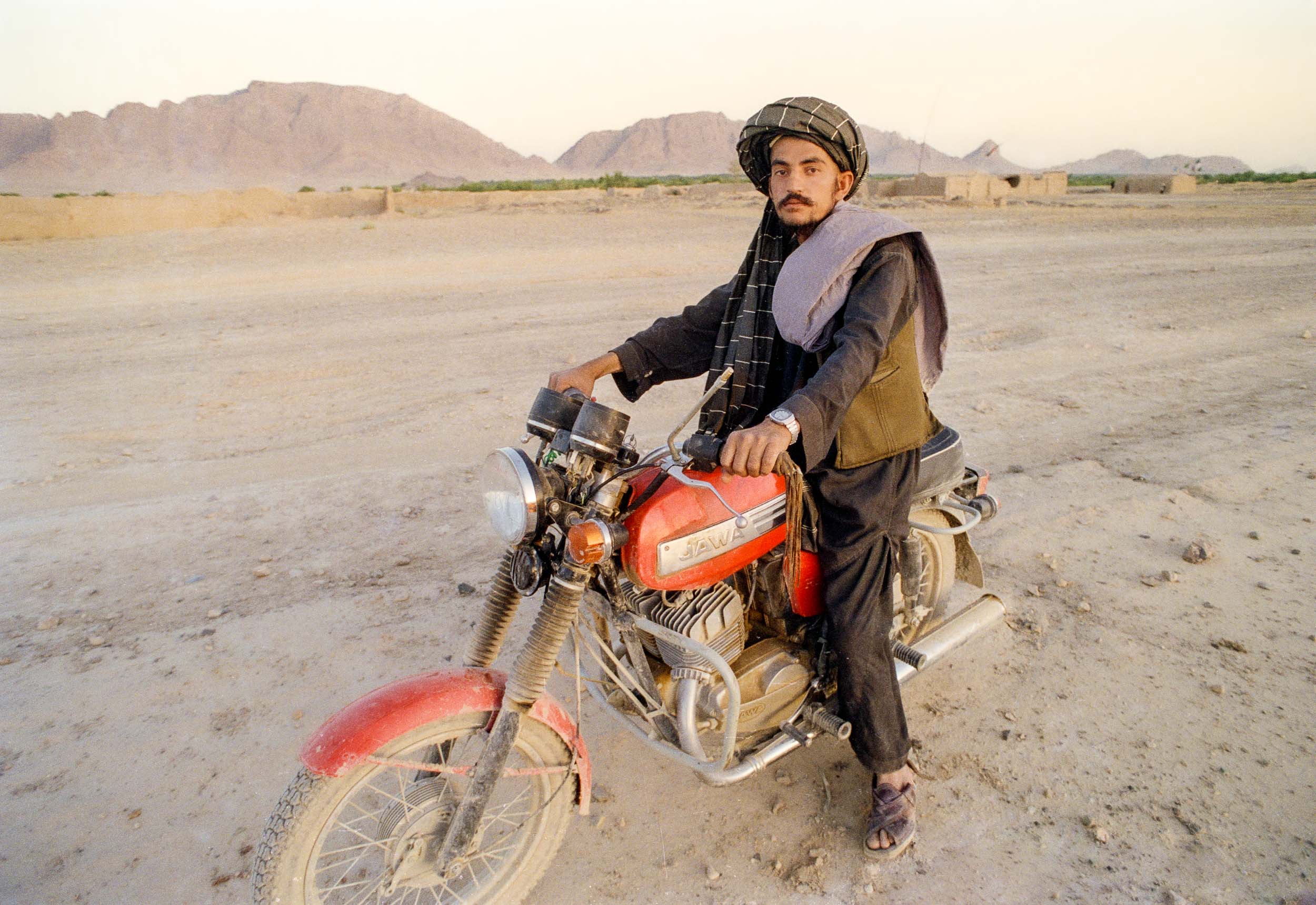 Mujahideen on a Czech made motorcycle, my ride back to Pakistan., Afghanistan 1988