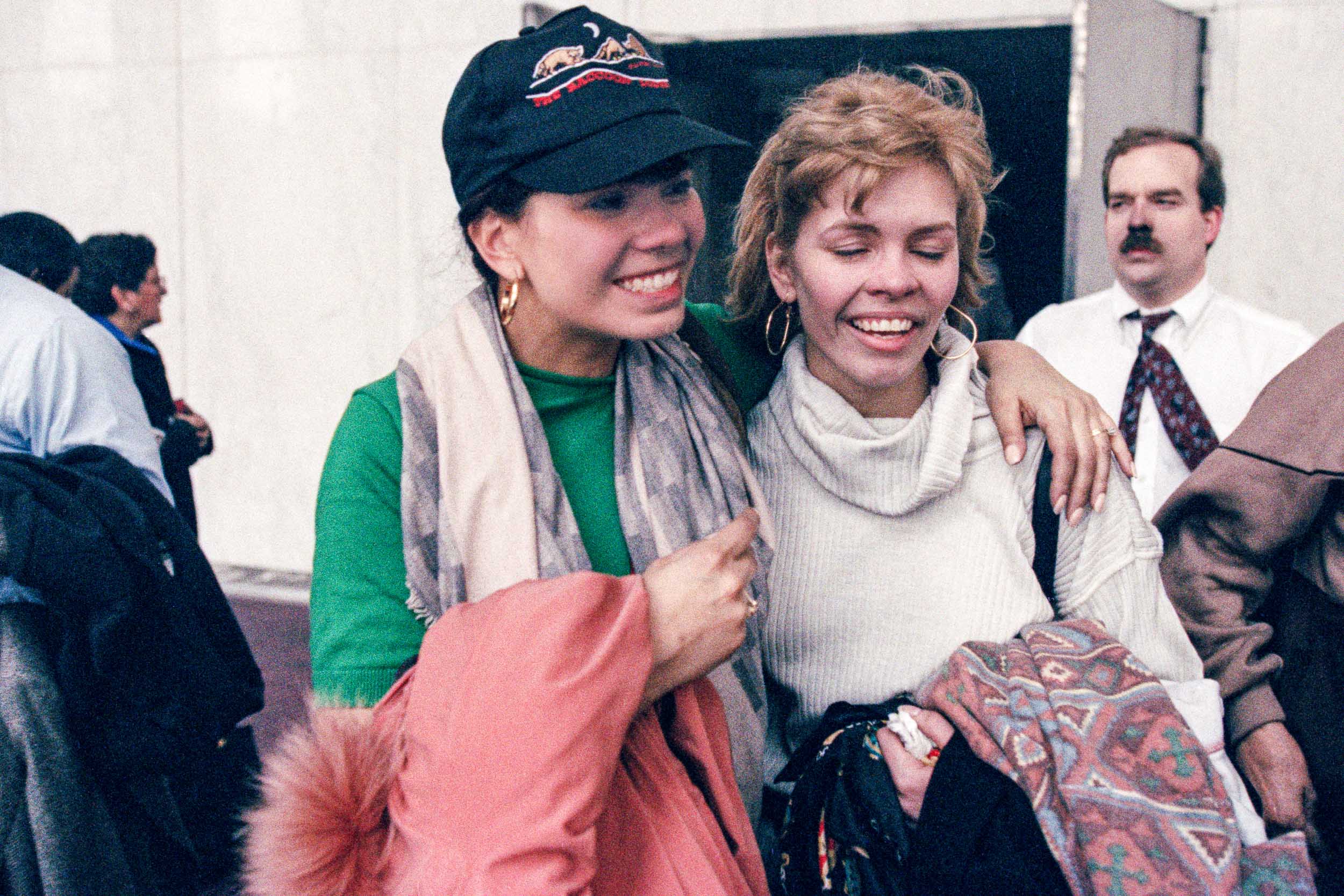 Office workers reuniting with joy  in the lobby of the World Trade Center, NY, 1993