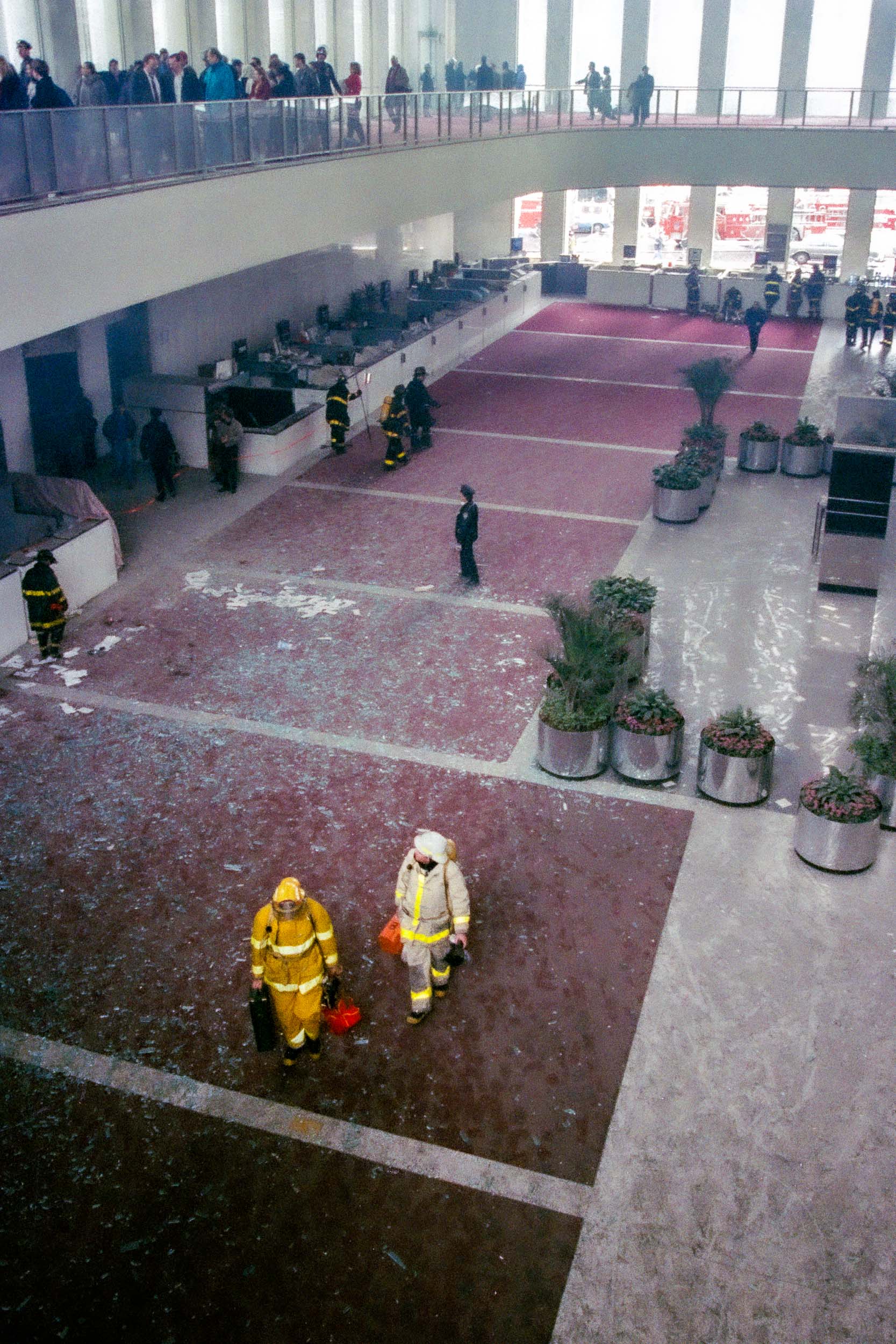 Office workers in the upper lobby and firemen in the lower lobby of the World Trade Center, NY, 1993