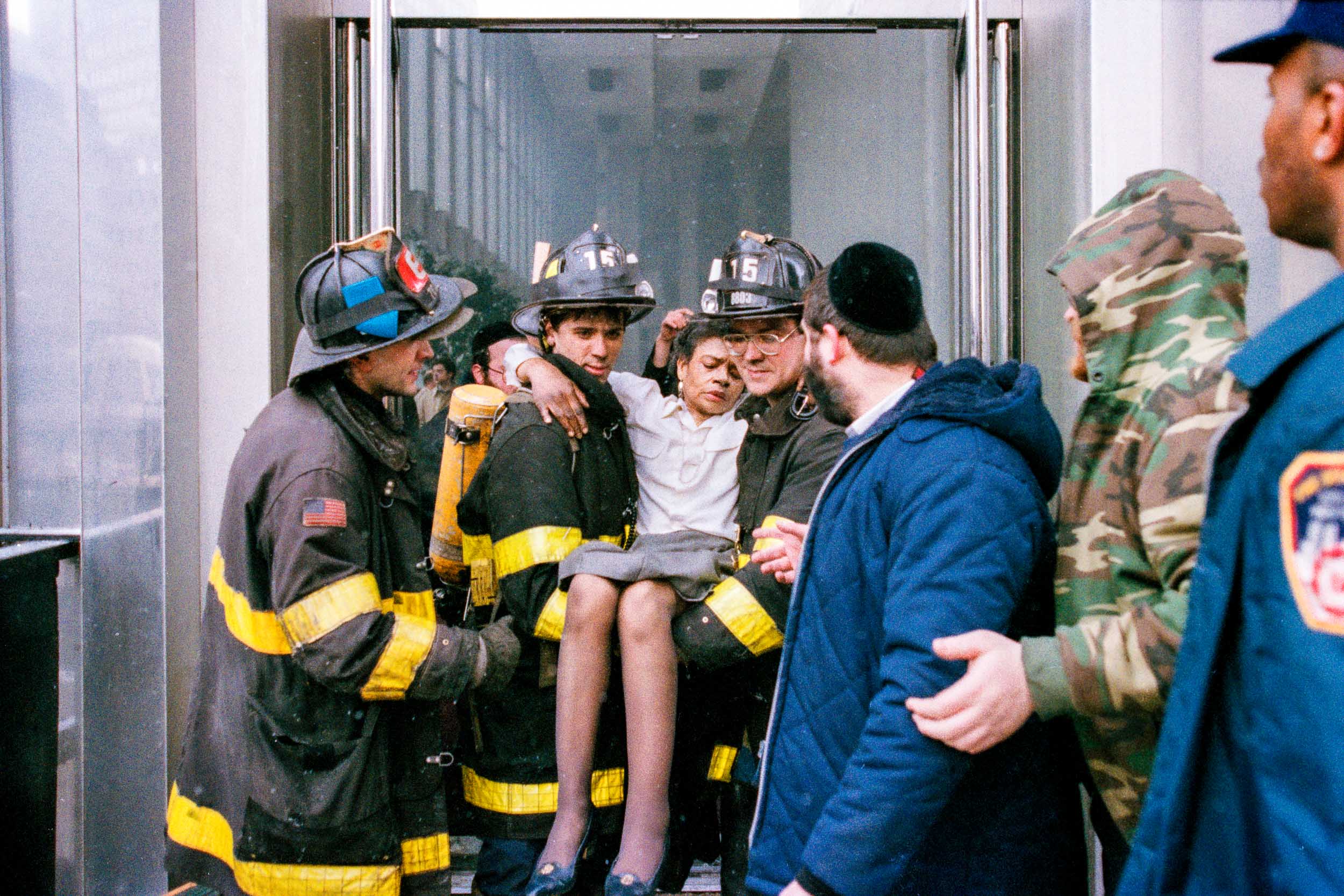  Firemen carry out an injured office worker from the lobby of the World Trade Center, NY, 1993