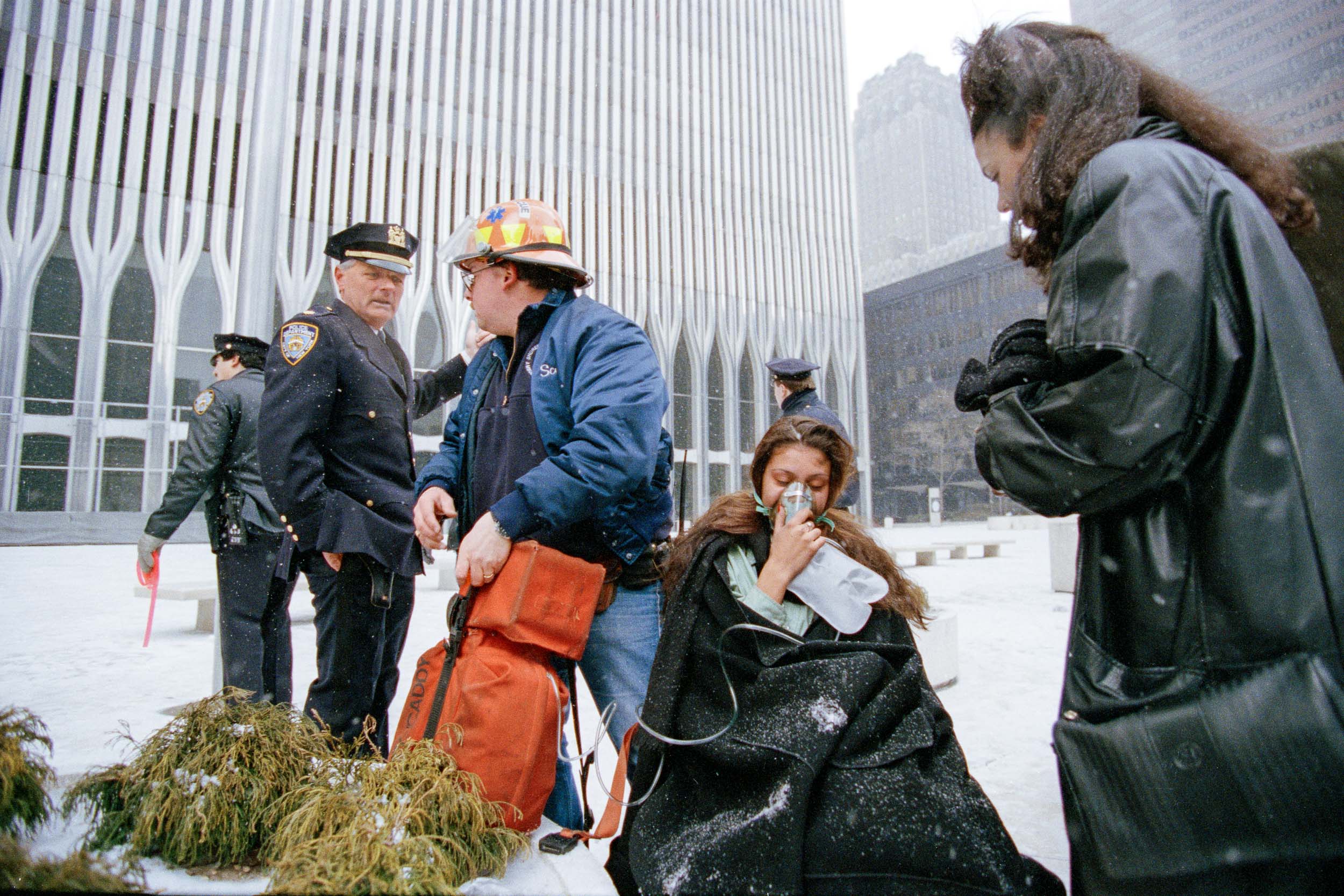 An office worker receives oxygen from an EMS outside the World Trade Center, NY, 1993