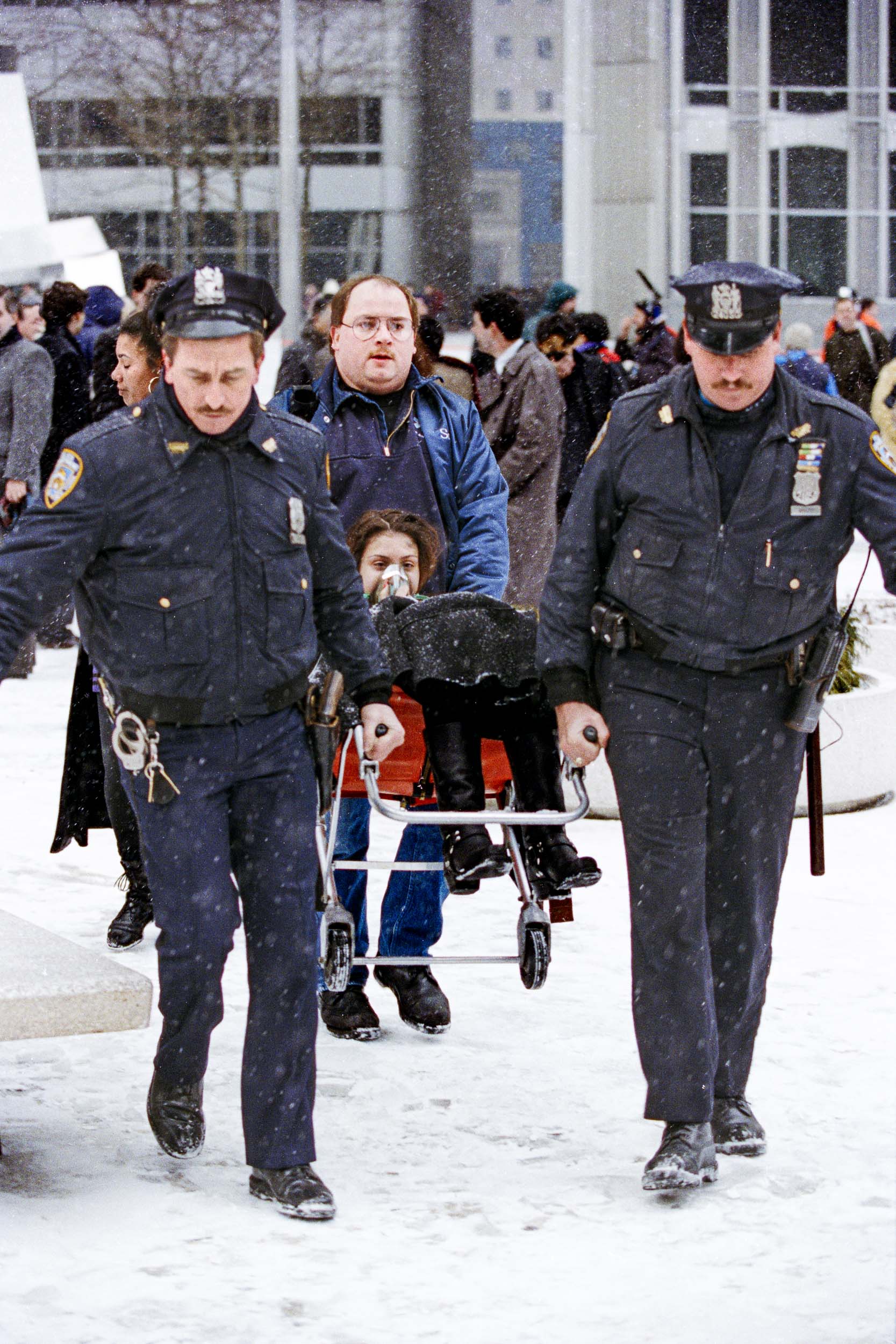 Police assist an EMS with a disabled worker away from the World Trade Center, NY, 1993