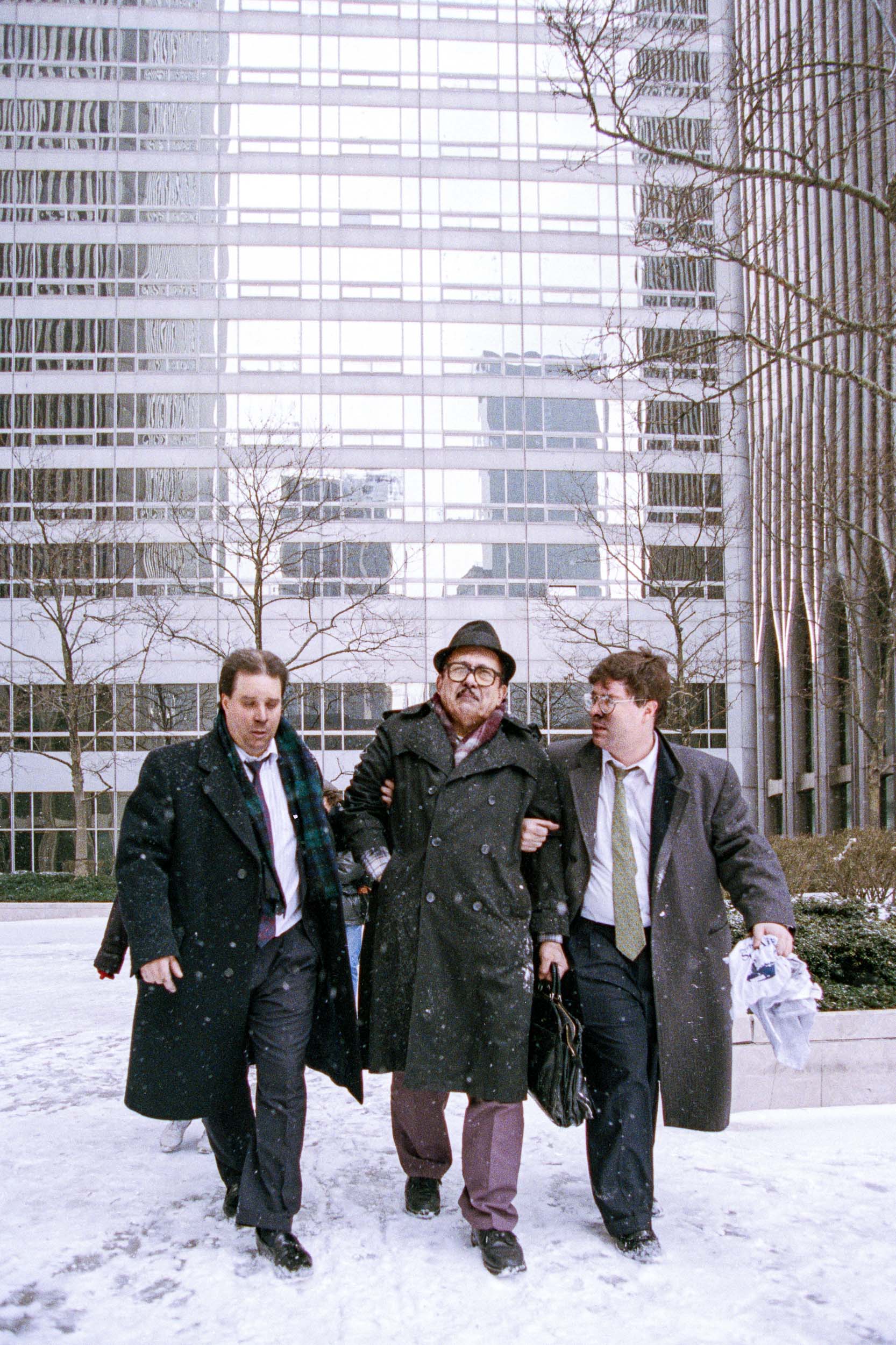 Stunned office workers walk away from the World Trade Center, NY, 1993