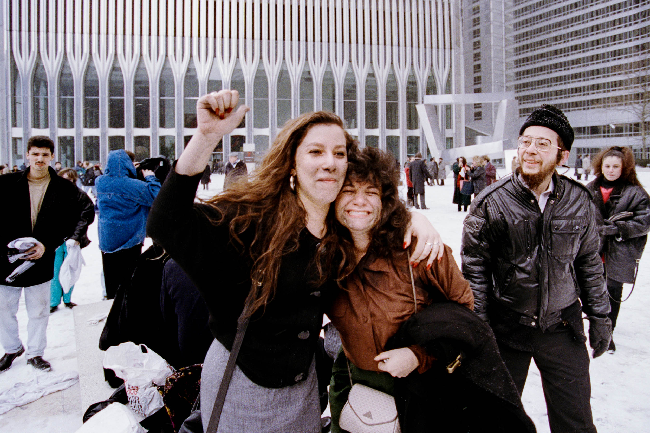 Office workers reuniting with joy  in the Plaza of the World Trade Center, NY, 1993