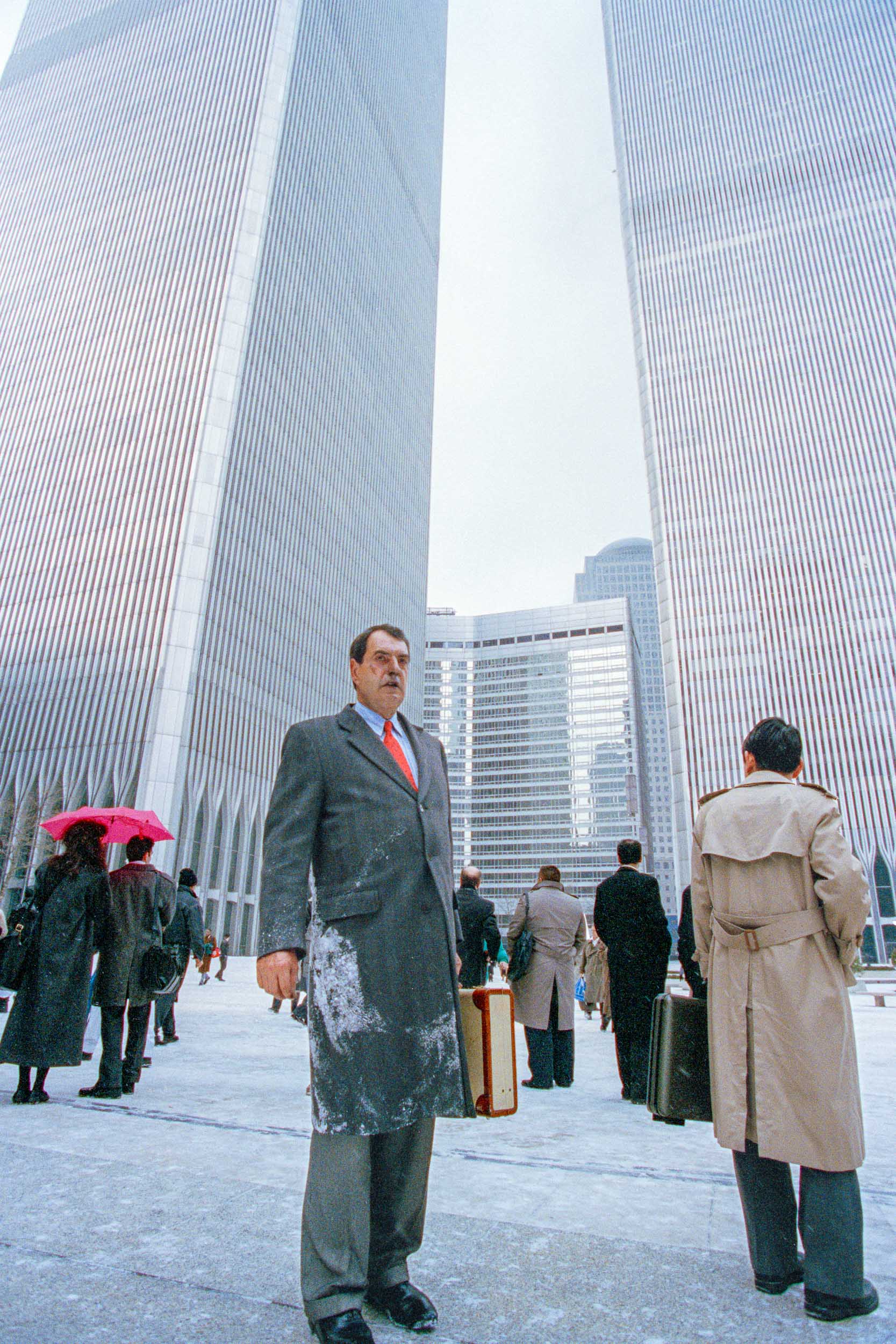 Stunned office workers stand around after walking away from the World Trade Center, NY, 1993