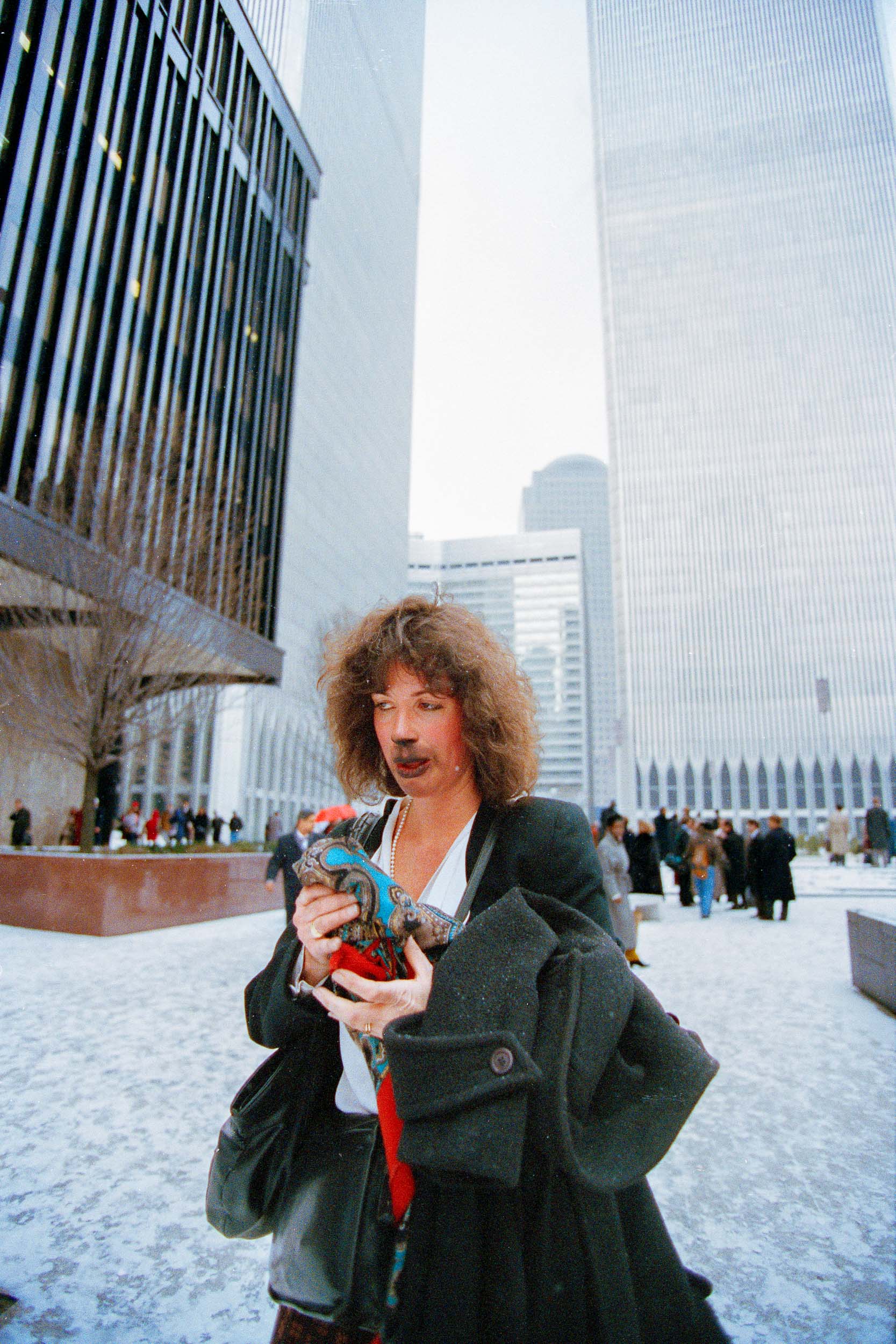 A stunned office worker walks away from the World Trade Center, NY, 1993