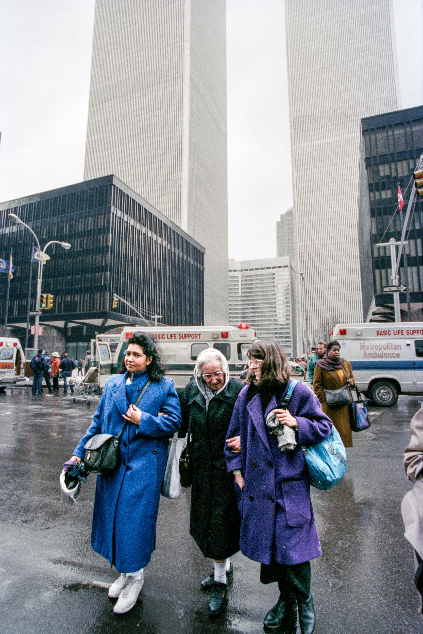 Stunned office workers walk away from the World Trade Center, NY, 1993